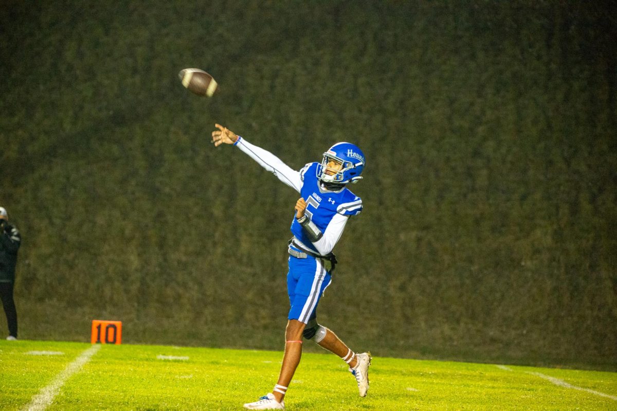 Caleb Northcroft throws a pass against Rogers High School during first quarter, Sept. 22, in Pullman, Wash. 