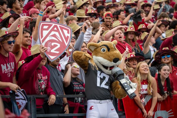 Butch T. Cougar leading the Cougs in singing "Back Home" by Andy Grammar after the first quarter against Oregon State, Sept. 23, in Pullman, Wash. 