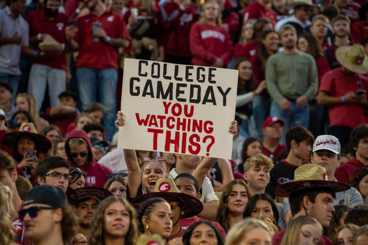 Fans hold up a sign mocking ESPN College Gameday at a game against Oregon State September 23, 2023 in Pullman, Wash.