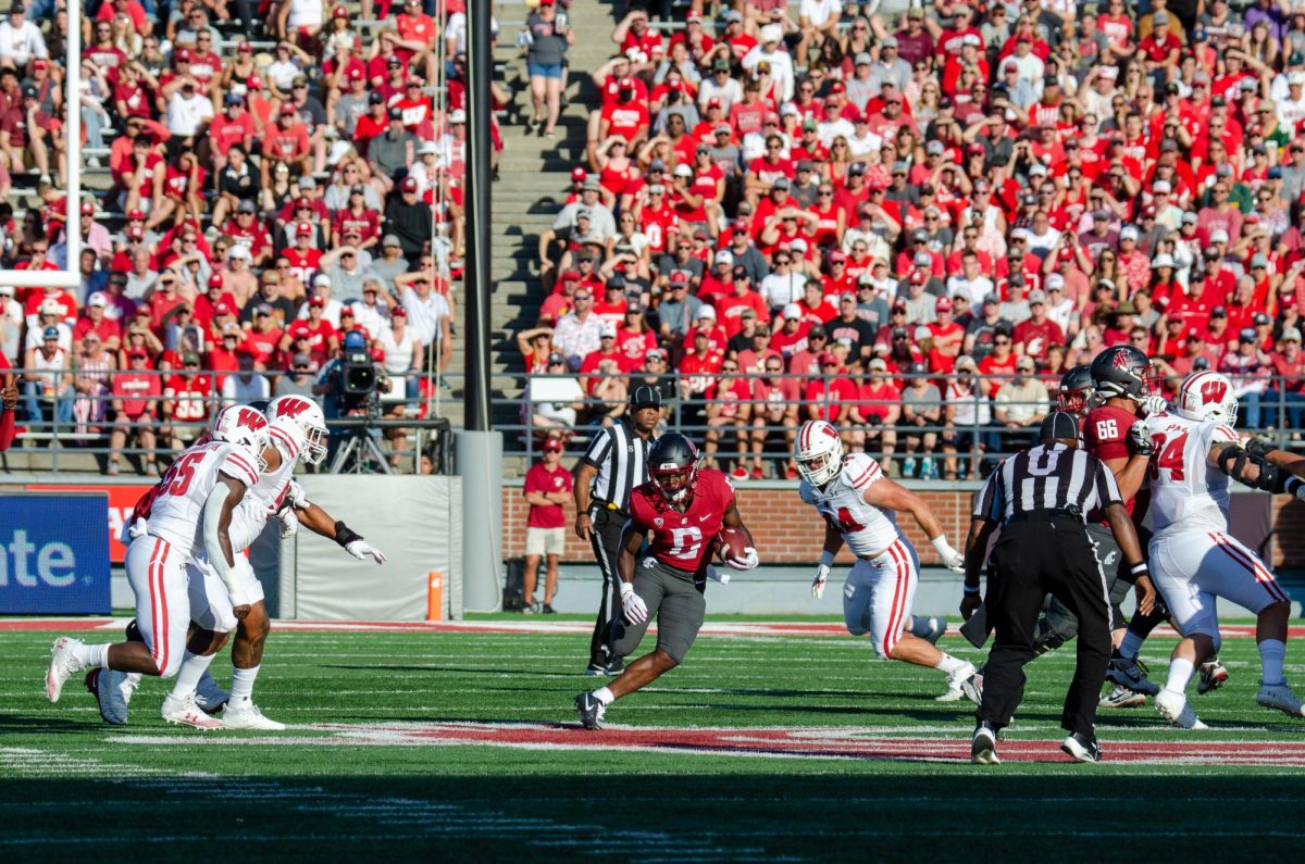 Jaylen Jenkins finds a hole in the Badgers defense early in the game, Sept. 9. 