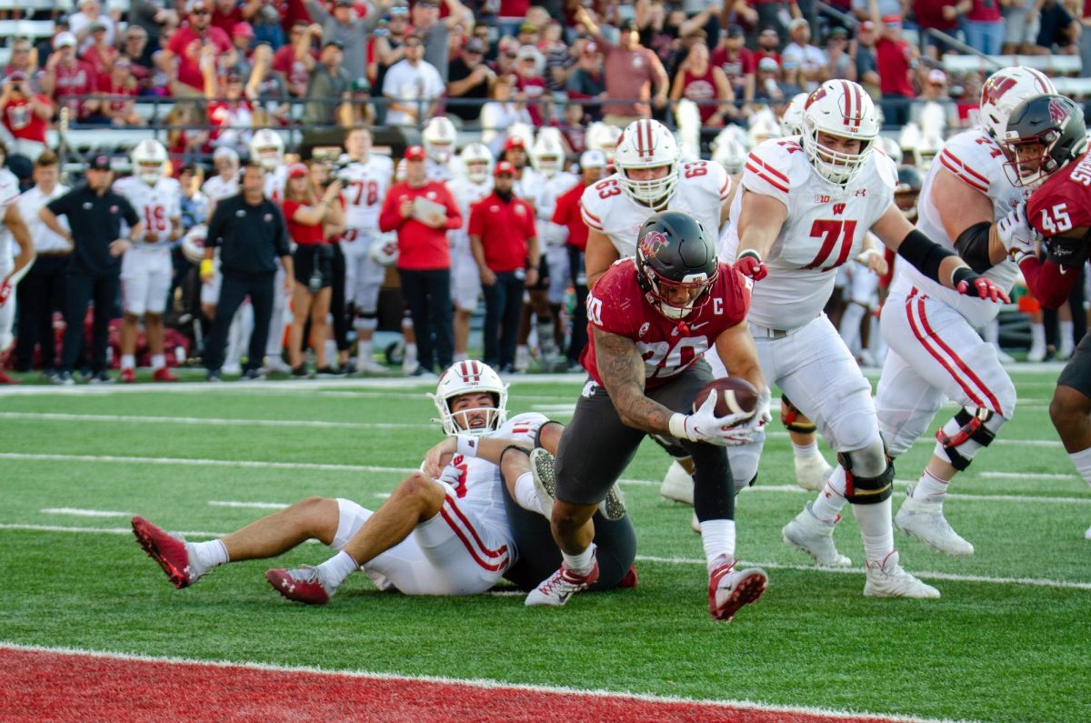 Brennan Jackson scoops up a loose football right near the end zone to score for WSU, Sept. 9. 