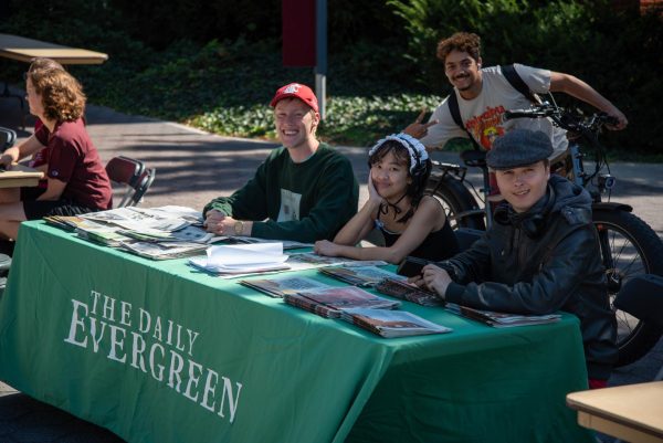 Daily Evergreens managing editor Sam Taylor, life editor Gabrielle Feliciano and news co-editor Josiah Pike table at Get Involved Fair, Sept. 6. 