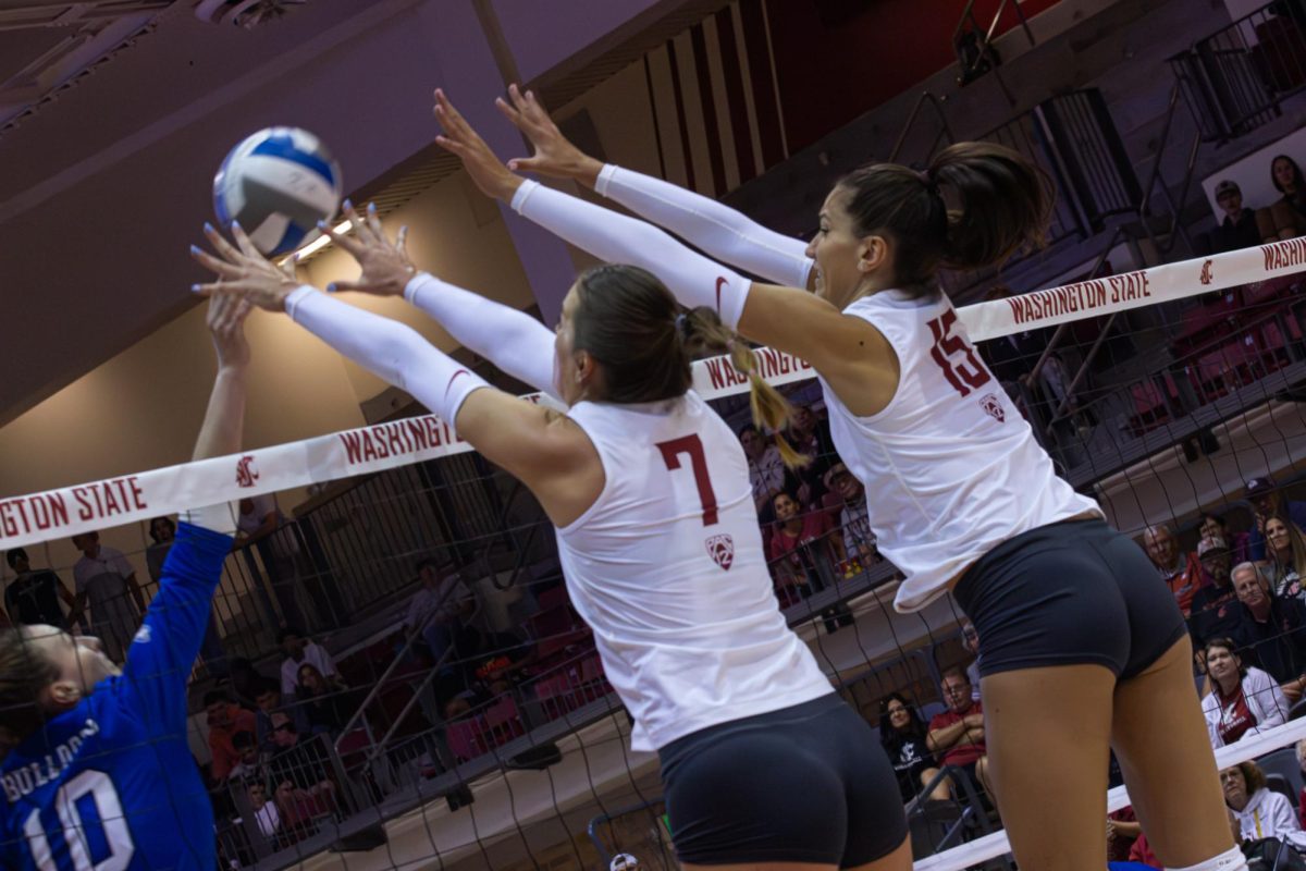 Pia Timmer and Magda Jehlárová team up to go for a block against Drake, Sept. 1, in Pullman, Wash. 