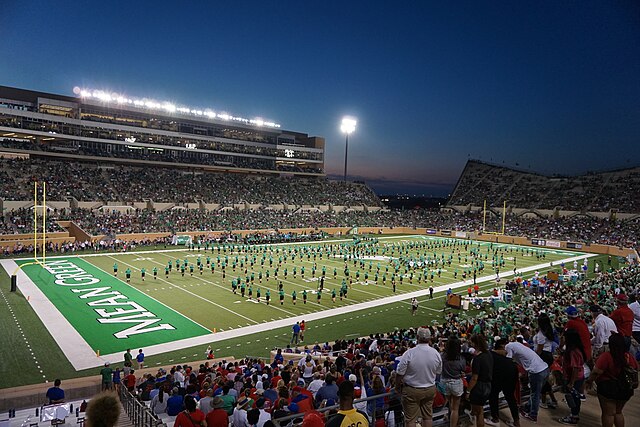 The Green Brigade Marching Band performing during halftime of the Southern Methodist Mustangs vs. North Texas Mean Green football game at Apogee Stadium in Denton, Texas (United States). 