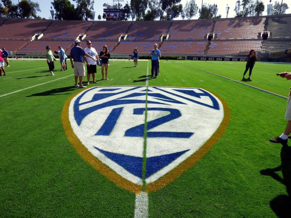 Pac-12 logo on the turf at UCLAs home stadium the Rose Bowl in Pasadena, Calif.