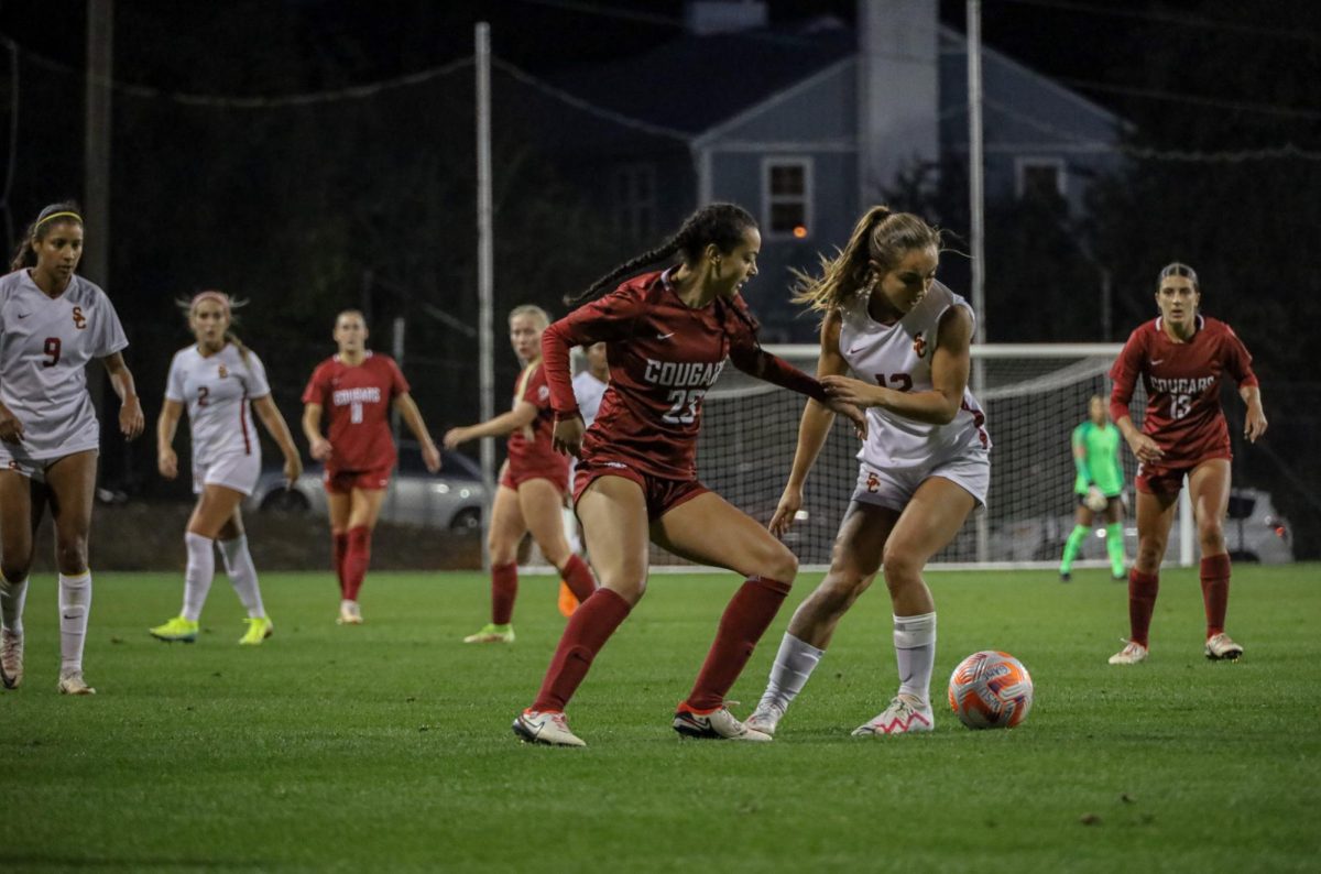 WSU number 23, defender Bryana Pizarro, fights for the ball against USC player 12, Zoe Burns at an NCAA womens soccer game against USC, Sept. 28, 2023, in Pullman, Wash.