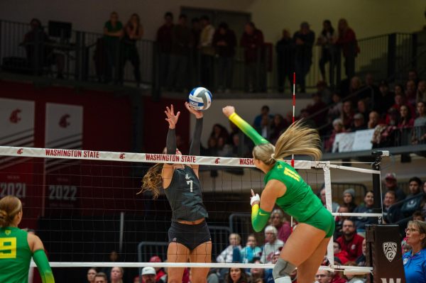 Pia Timmer blocks an Oregon Ducks offensive attack during an NCAA volleyball match, Oct. 27, in Pullman, Wash. 