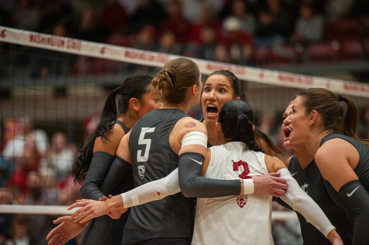 Magda Jehlárová and several other Cougs celebrate after Iman Isanovic gets a big kill, Oct. 27, in Pullman, Wash. 