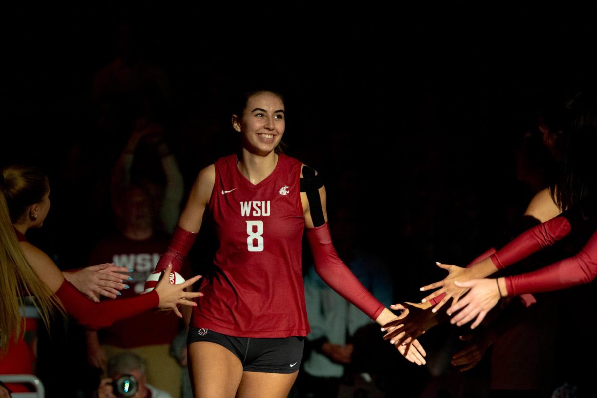 Katy Ryan runs onto the court during starter introduction, Oct. 6, in Pullman, Wash. 