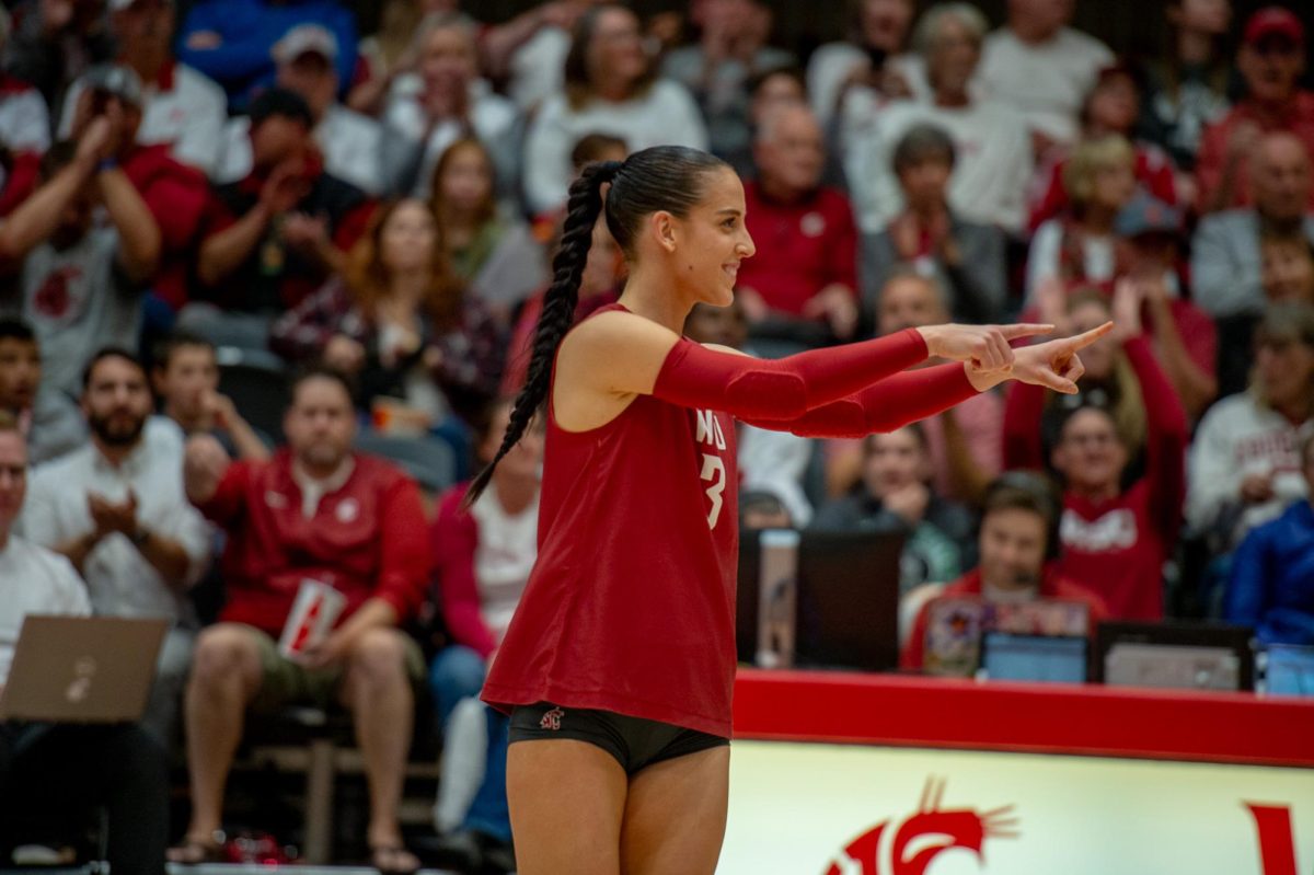 Karly+Basham+points+toward+the+front+row+after+WSU+wins+a+point+in+an+NCAA+volleyball+match%2C+Oct.+13%2C+in+Pullman%2C+Wash.