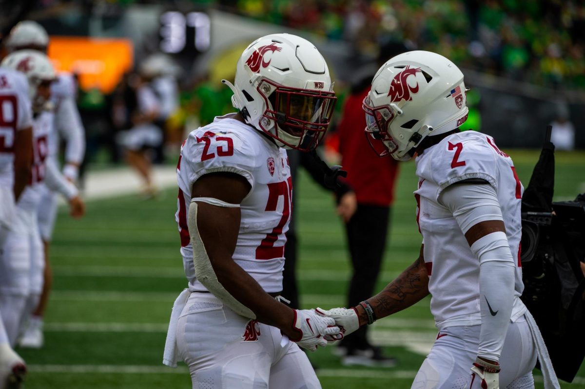 Nakia Watson and Kyle Williams celebrate after a first-quarter TD, Oct. 21, in Eugene, Oregon.  