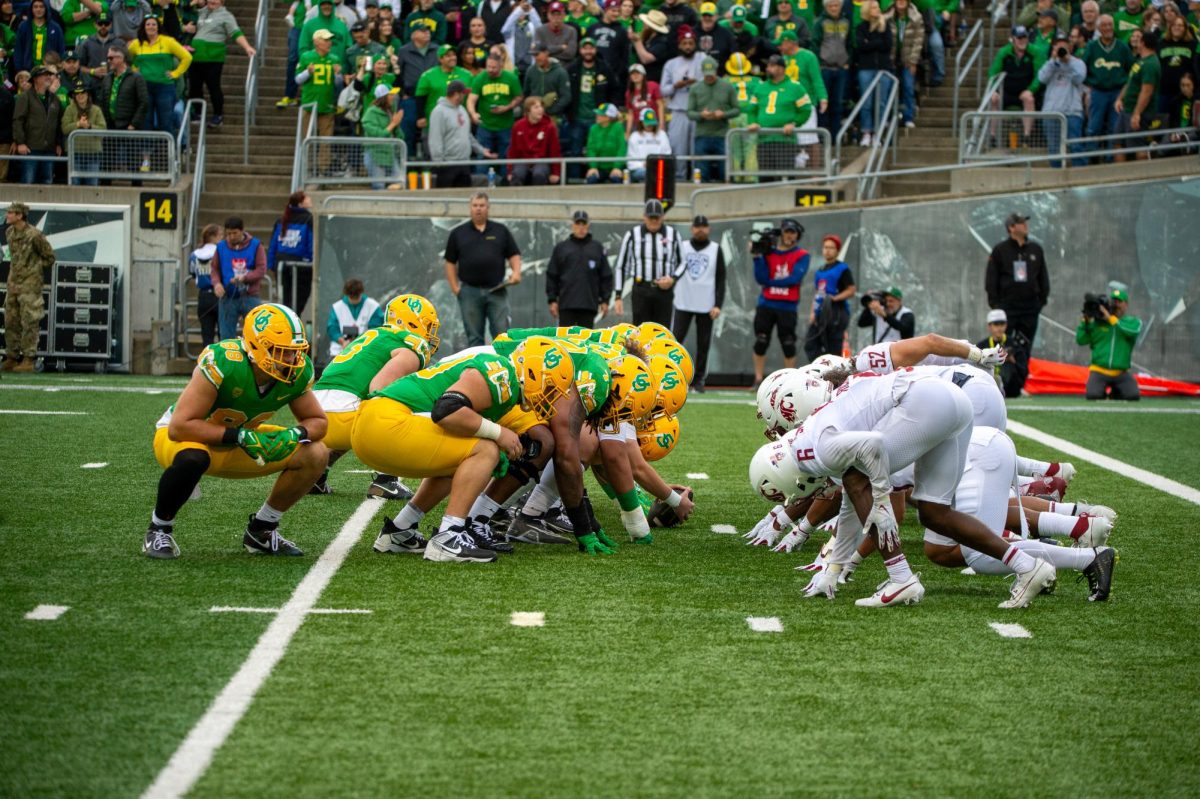 The Ducks and Cougs line up for an extra-point conversion, Oct. 21, in Eugene, Oregon. 