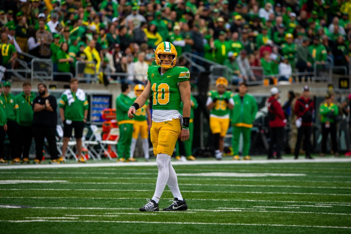 Bo Nix looks toward his receivers before taking a snap against WSU, Oct. 21, in Eugene, Oregon. 
