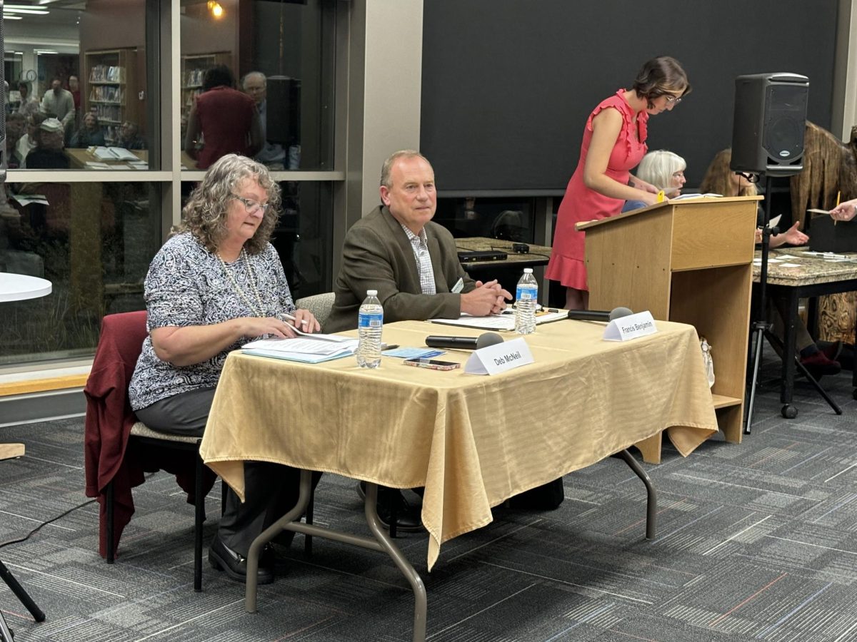 Deb McNeil (left) and Francis Benjamin (right) speaking at a candidate forum on Oct. 18