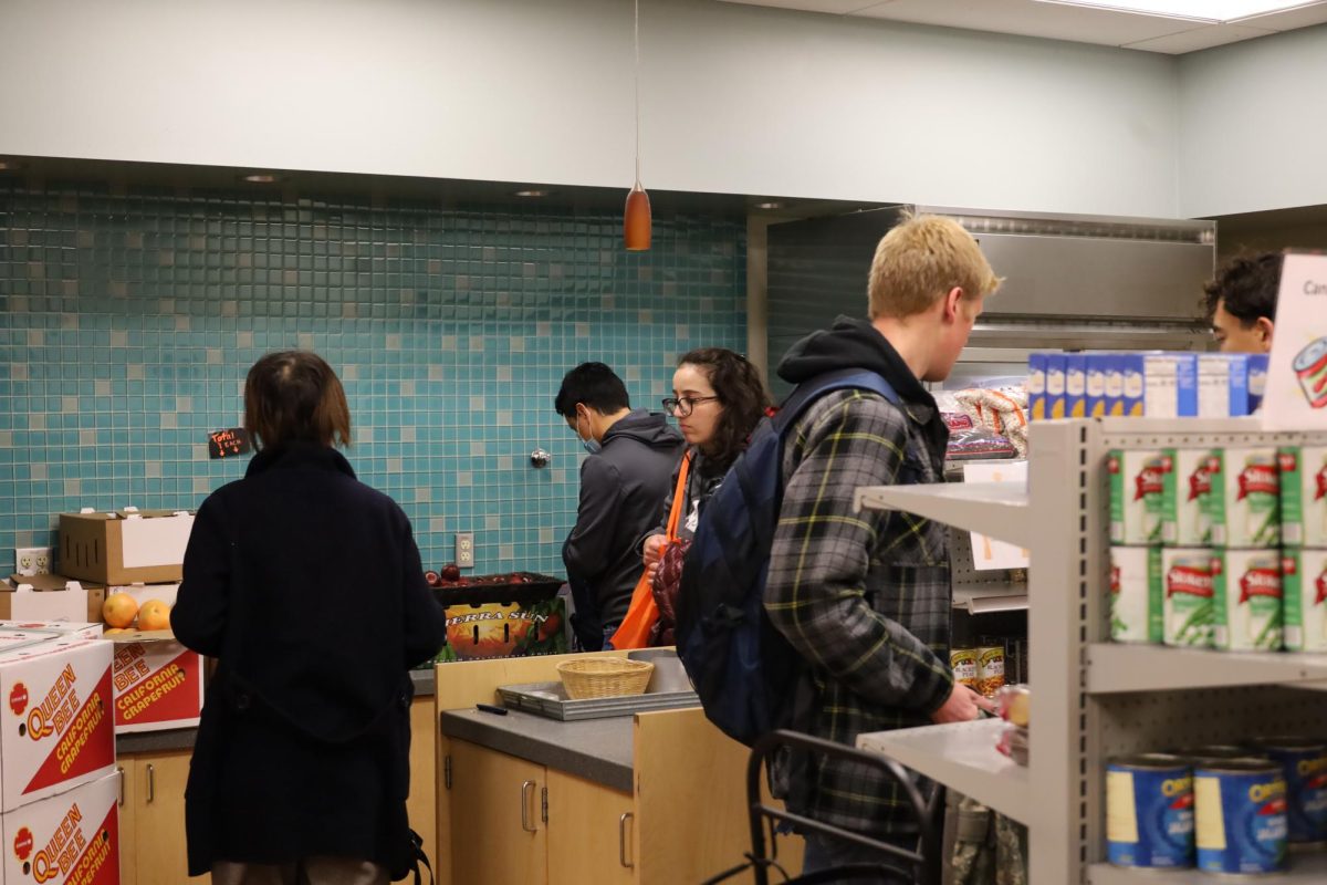 The Cougar Food Pantry in use by students, with a large number of attendees being graduate students