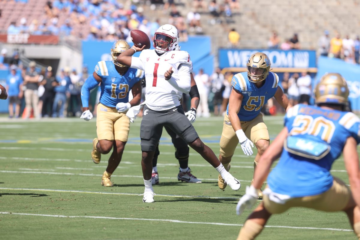 WSU quarterback Cam Ward attempts a pass in an NCAA football game against the UCLA Bruins October 7, 2023 in the Rose Bowl in Pasadena, CA.