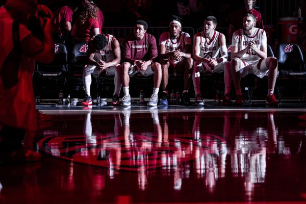 The WSU men’s basketball team prepares for player introductions before an NCAA men’s basketball game against Eastern Washington, Nov. 27, 2023, in Pullman, Wash.