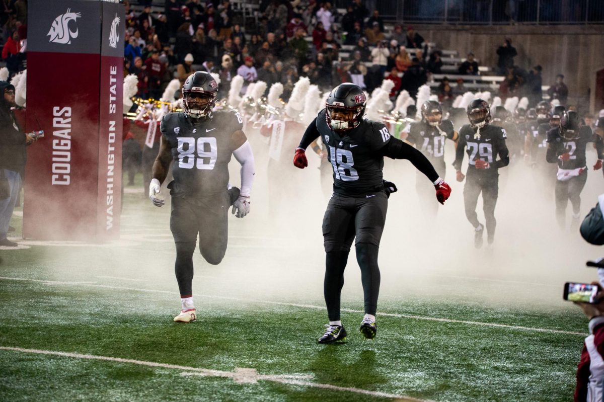 Taariq Al-Uqdah pumps himself up as the Cougs take the field to take on Colorado, Nov. 17, in Pullman, Wash. 