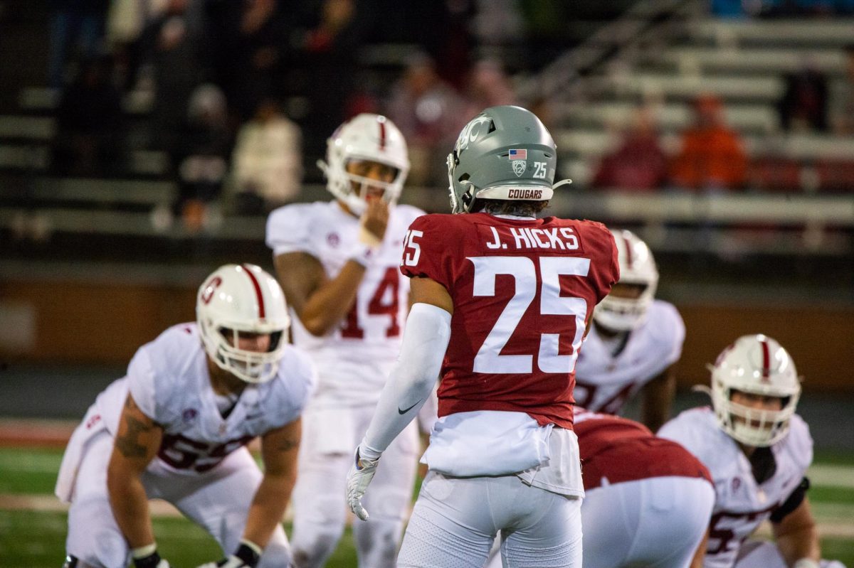 Jaden Hicks eyes Stanford's Ashton Daniels looking to make a play, Nov. 4 2023, in Pullman, Wash. 