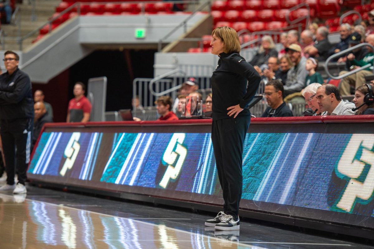 WSU head coach Kamie Ethridge looks on as her team takes down Cal Poly in the season opener, Nov. 6, in Pullman, Wash.  