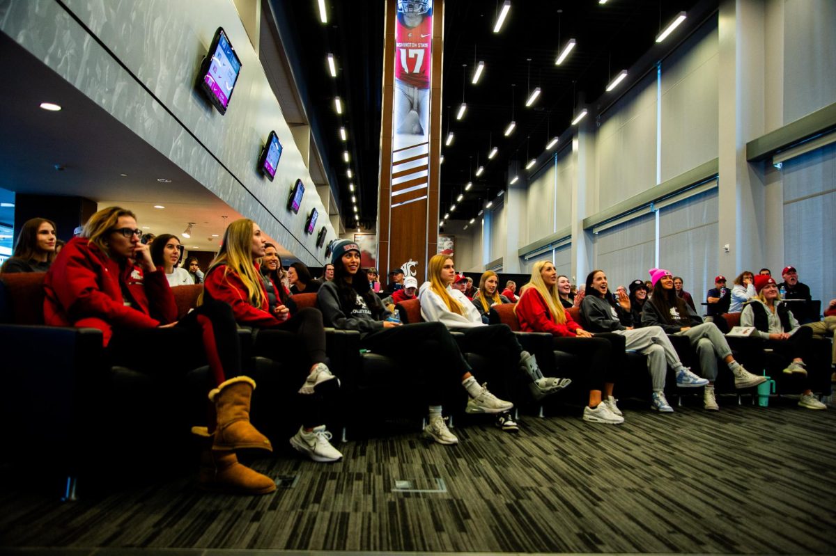 WSU+volleyball+eagerly+sits+and+watches+for+their+name+to+be+called+for+the+2023+NCAA+Tournament%2C+Nov.+26%2C+in+Pullman%2C+Wash.+