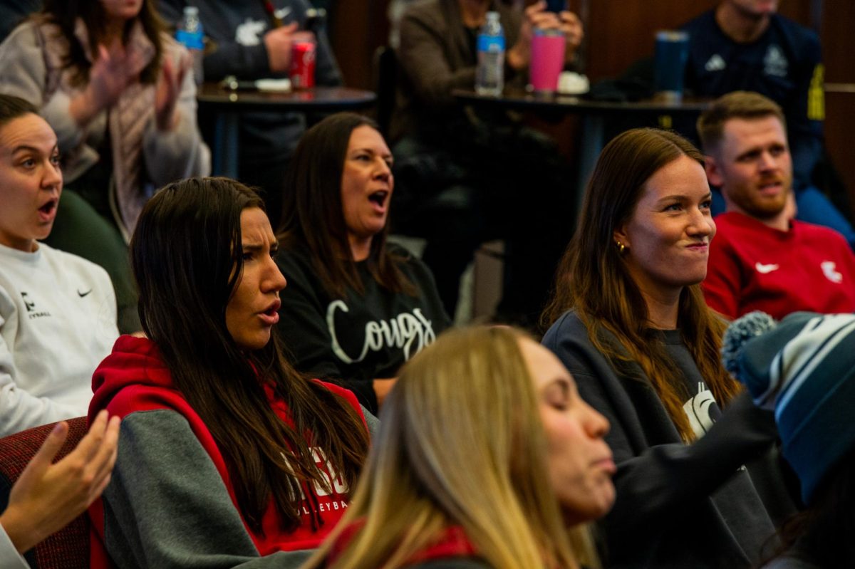Magda Jehlárová (left) and Pia Timmer (right) react as the team earns a No. 4 seed in the NCAA Volleyball tournament, Nov. 26, in Pullman, Wash. 