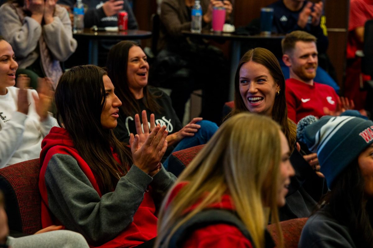 Magda Jehlárová (left) and Pia Timmer (right) react as the WSU volleyball team earns a No. 4 seed in the NCAA Volleyball tournament, Nov. 26, in Pullman, Wash. 