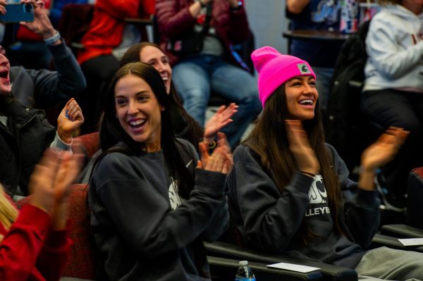 Karly Basham (left) and Jasmine Martin (right) react as the WSU volleyball team earns a No. 4 seed in the NCAA Volleyball tournament, Nov. 26, in Pullman, Wash. 