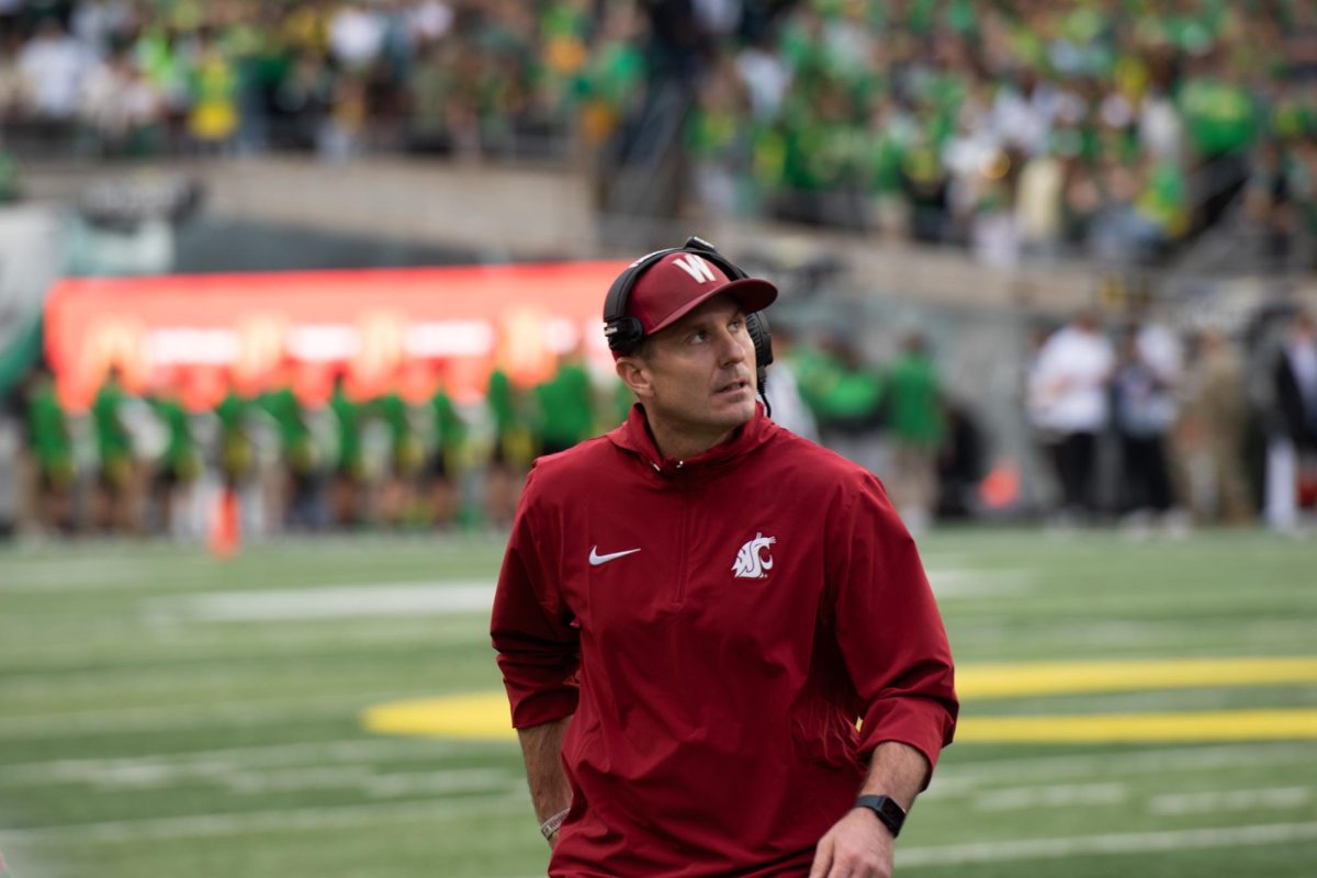 Head coach Jake Dickert glances at the Autzen Stadium jumbotron during WSU football's 38-24 loss to Oregon, Oct. 21. 2023 at Autzen Stadium in Eugene, Oregon.