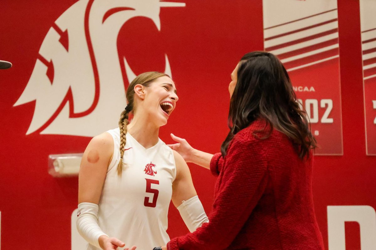 Iman Isanovic laughs with head coach Jen Greeny during WSU volleyballs second senior day celebration, Nov. 12, in Pullman, Wash.