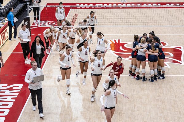 The WSU women’s volleyball team heads to the locker room after winning the second set of an NCAA second-round match against Dayton, Dec. 2, 2023, in Pullman, Wash.