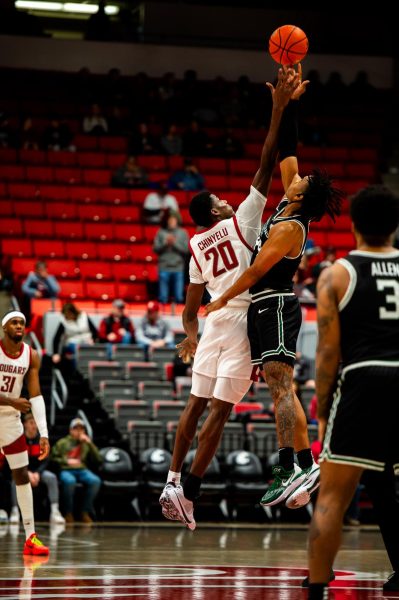 Rueben Chinyelu rises for the opening tip against Portland State, Dec. 2, in Pullman, Wash.