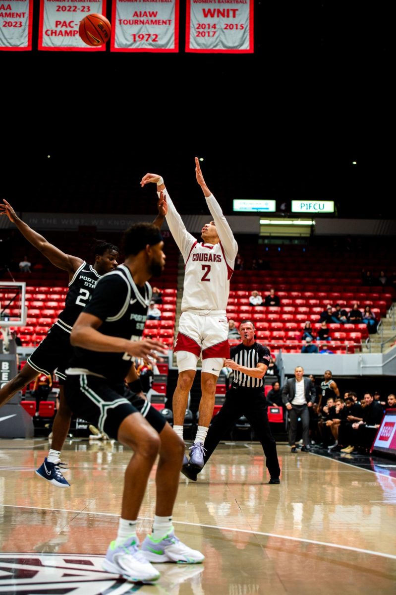 Myles Rice shoots a three-pointer during his 19-point outing against Portland State, Dec. 2, in Pullman, Wash.