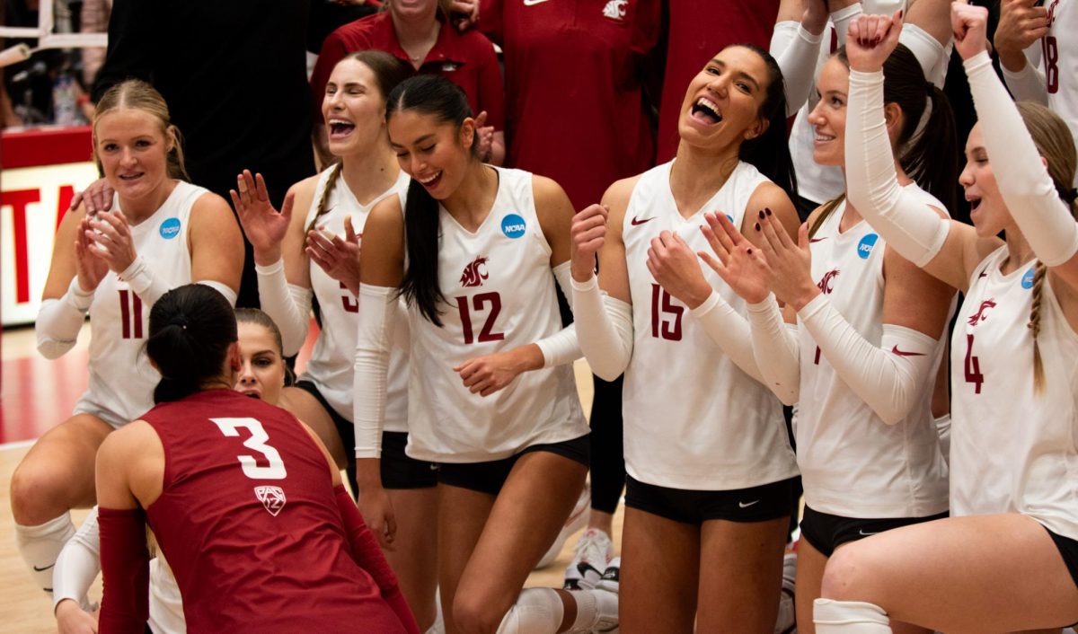 WSU volleyball players pose for a photo after their sweep of GCU in round one of the NCAA Tournament, Friday at Bohler Gym in Pullman, Wash.