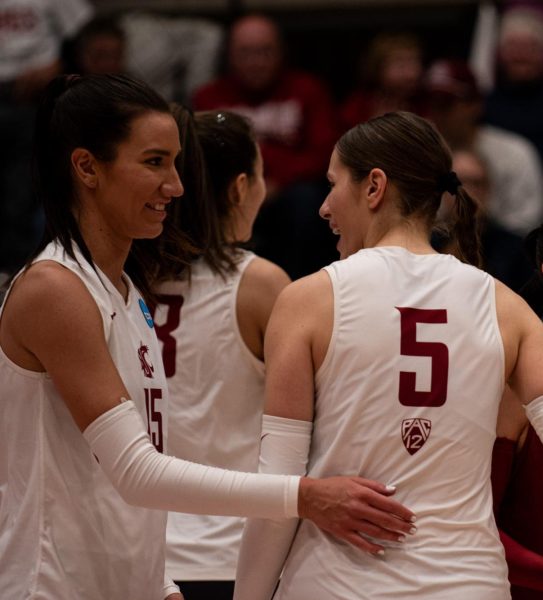 Magda Jehlárová and Iman Isanovic share a moment during WSU volleyballs round two match of the NCAA Tournament vs. Dayton Dec. 2 in Pullman, Wash.