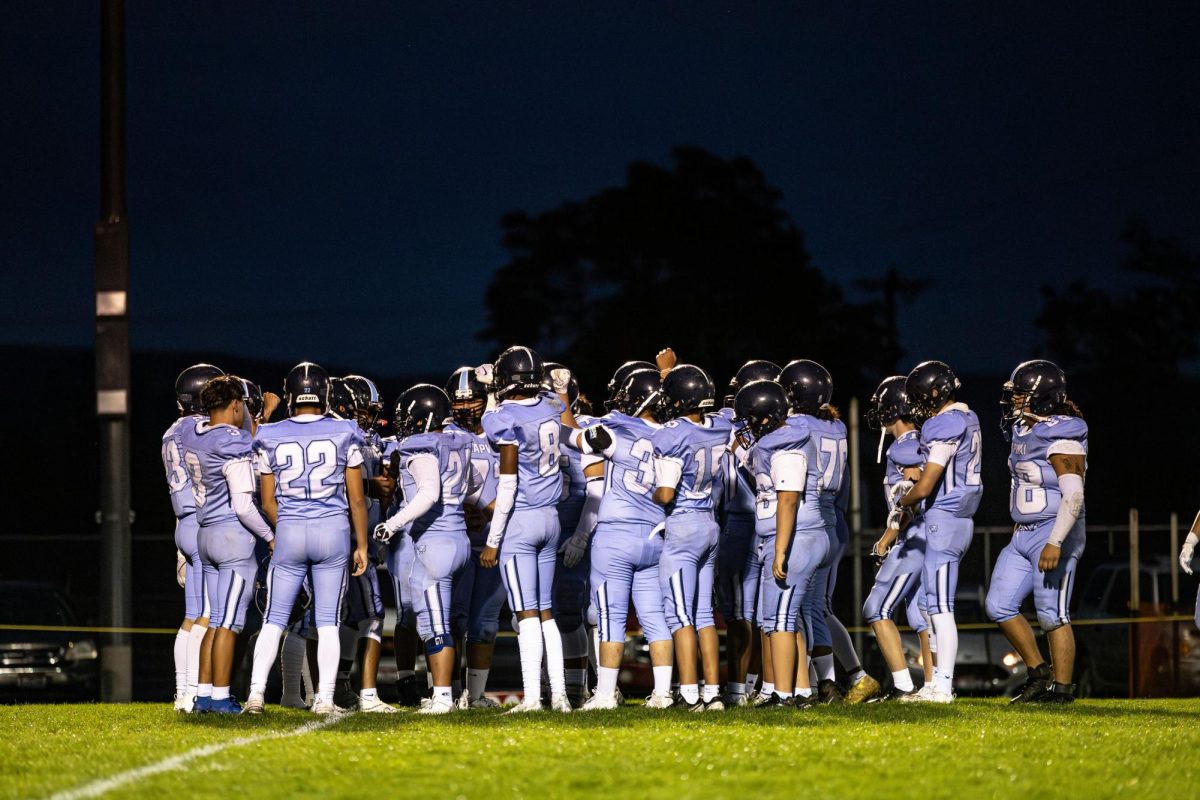 Lapwai Wildcats huddle before their homecoming matchup against Troy.