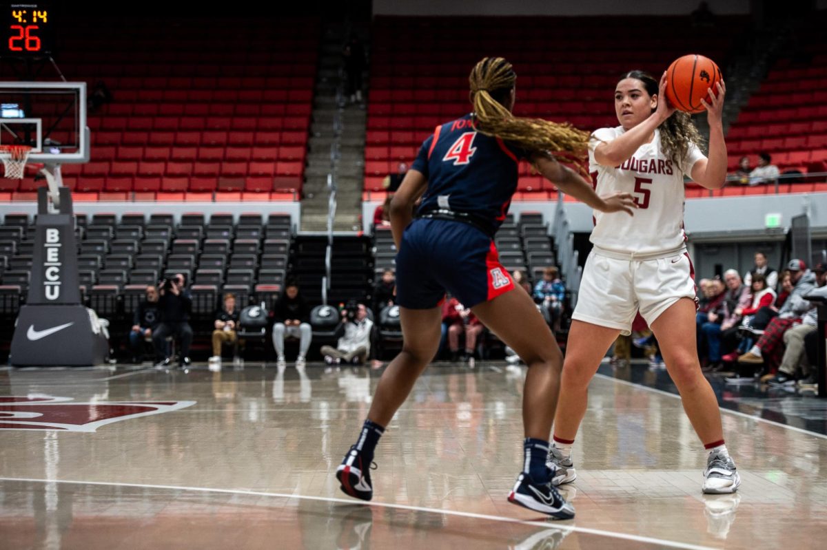 WSU guard Charlisse Leger-Walker protects the ball as a play is set up by the Cougs offense, Jan. 21, 2024, in Pullman, Wash.
