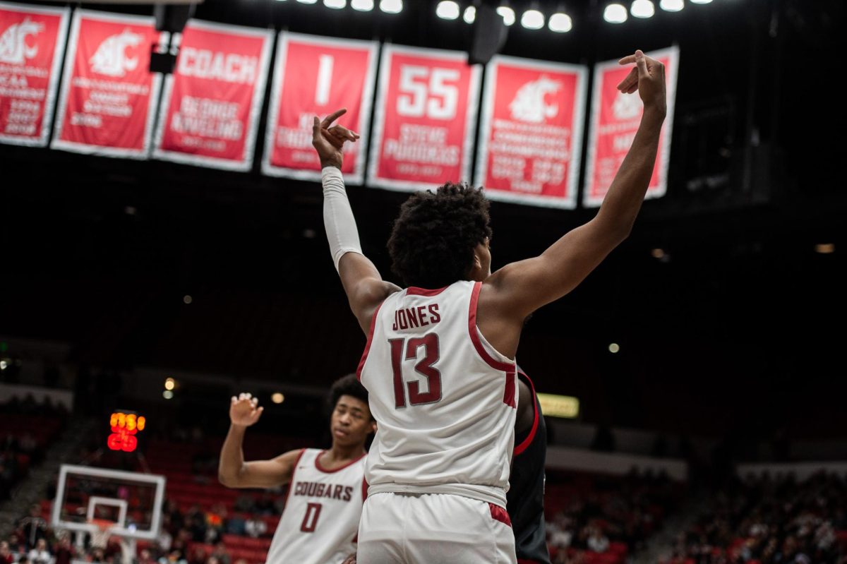 Isaac Jones celebrates toward the student section after a and-one play early in the Cougs win over Utah, Jan. 24 2024, in Pullman, Wash. 