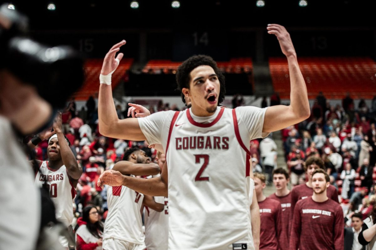 Myles Rice hypes up the crowd after the Cougs took down Colorado, Jan. 27, in Pullman, Wash.