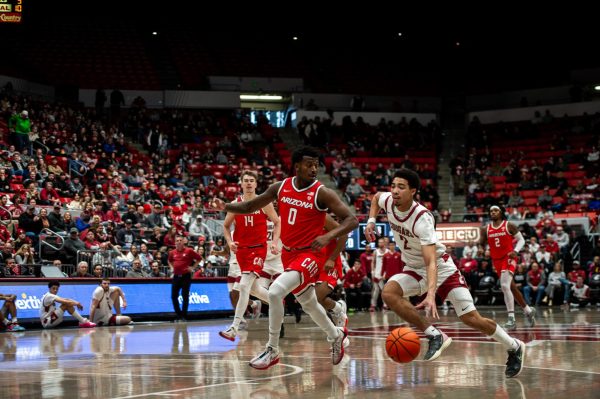 Myles Rice blows through the lane looking for contact for a and-one layup against Arizona, Jan. 13, in Pullman, Wash. 
