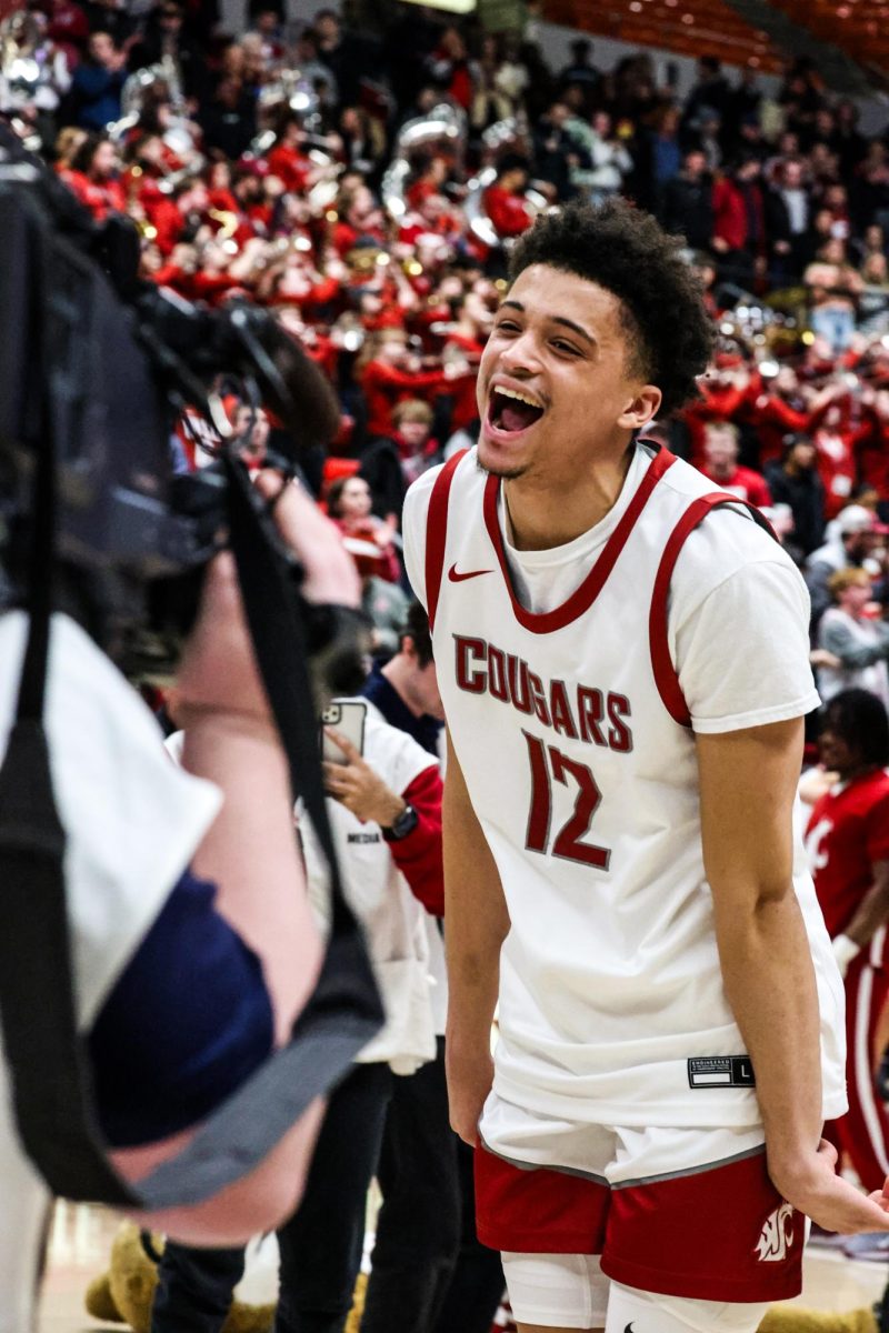 Guard Isaiah Watts screams in celebration for the cameras after defeating Arizona 73-70, Jan. 13, 2024, in Pullman, Wash. 