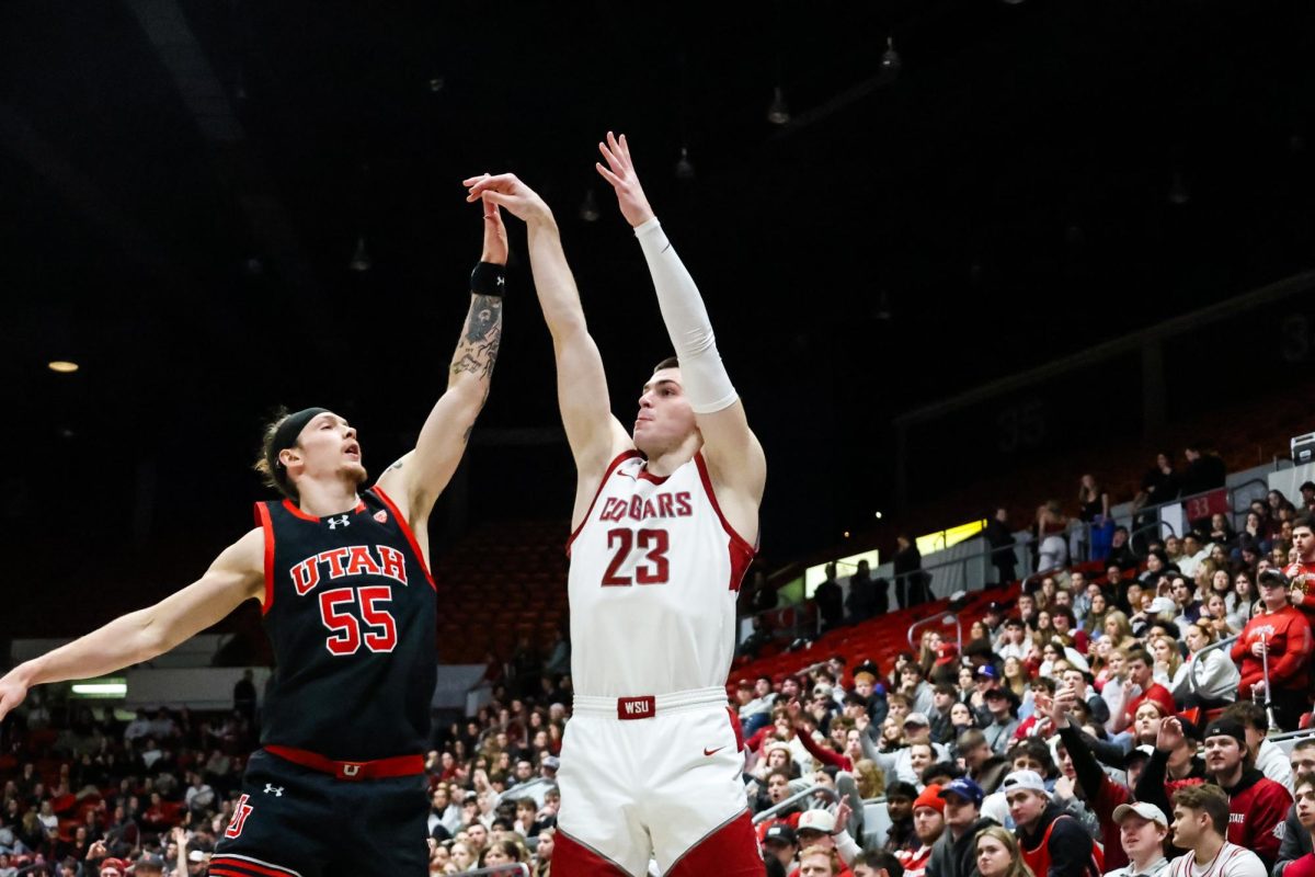 Forward Andrej Jakimovski goes for three in the face of a Utah defender during an NCAA mens basketball game, Jan. 24, 2024, in Pullman, Wash. 