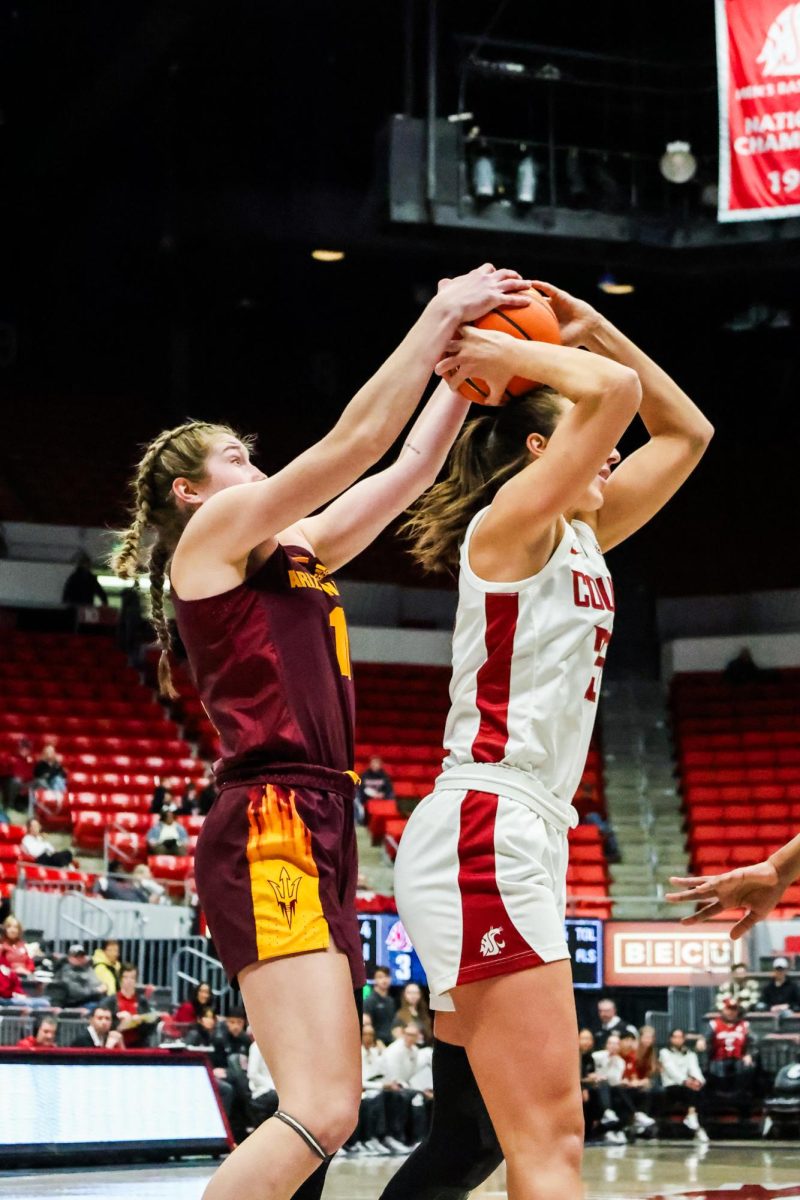 WSU guard and forward Beyonce Bea tries to keep the ball away from an Arizona State defender during an NCAA womens basketball game, Jan. 19, 2024, in Pullman, Wash.