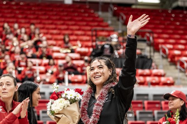 Charlisse Leger-Walker waves to the crowd during senior night, Feb. 25, in Pullman, Wash.
