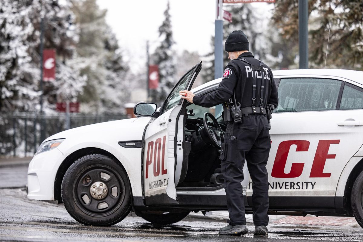 Police officers close Stadium Way near Beasley Coliseum, Feb. 15, 2024, in Pullman, Wash. Corporal Joseph Kirshner of the WSU Poice Department said the closure was due to a diesel spill.