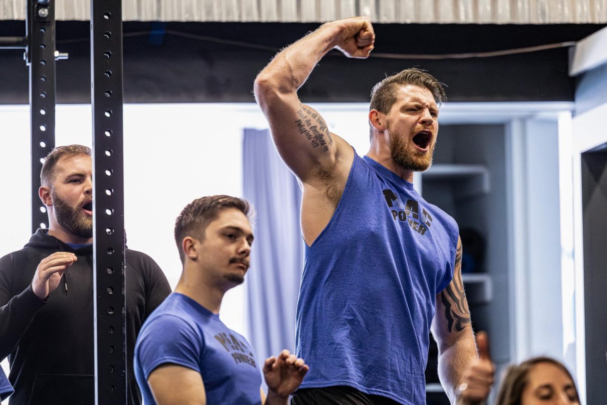 NIAC owner Blake Taylor cheers on competitors as they squat heavy weights, Jan. 20, 2024, in Moscow, Idaho. Taylor cheered for every single competitor while waiting for his turn to lift.