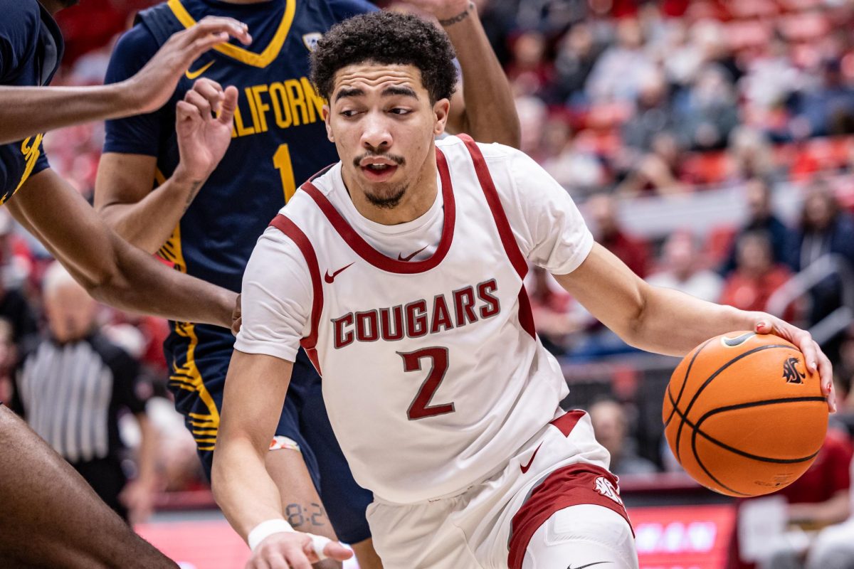 WSU guard Myles Rice drives to the basket during an NCAA basketball game against California, Feb. 15, 2024, in Pullman, Wash.