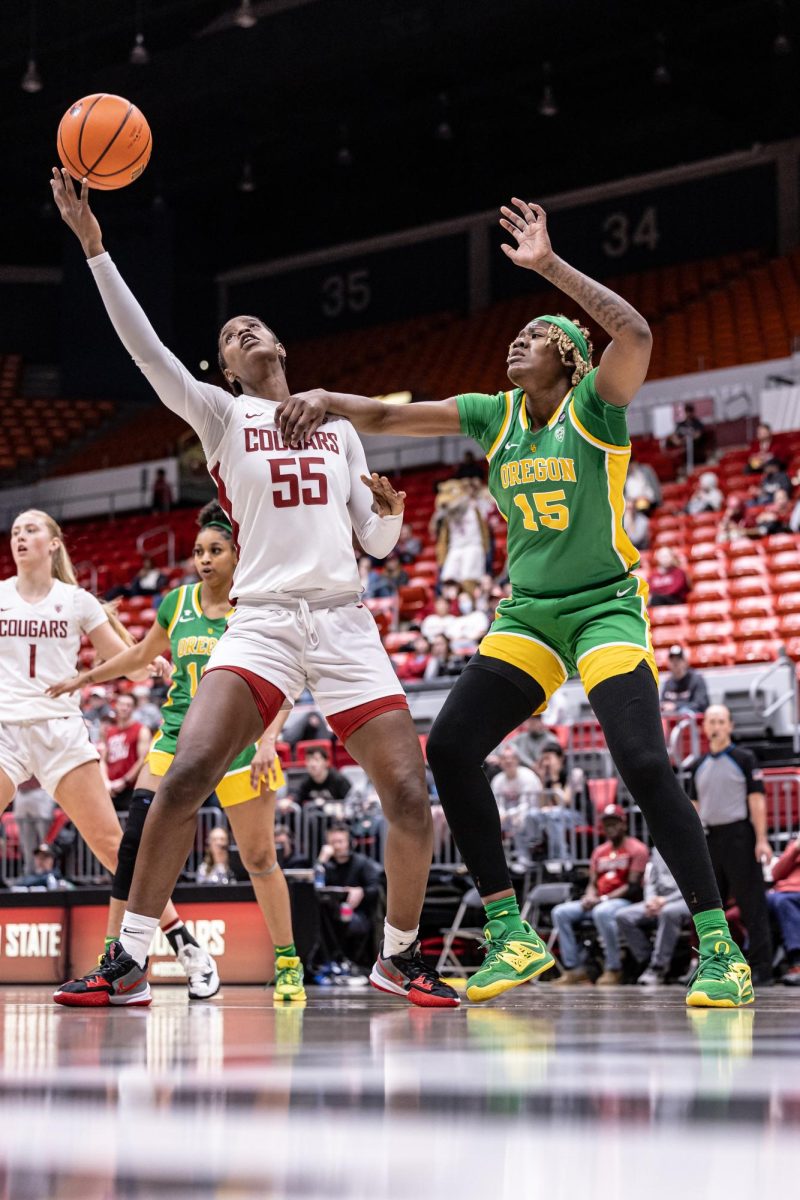 WSU center Bella Murekatete battles Oregon center Phillipina Kyei for a rebound during an NCAA women’s basketball game, Feb. 25, 2024, in Pullman, Wash.