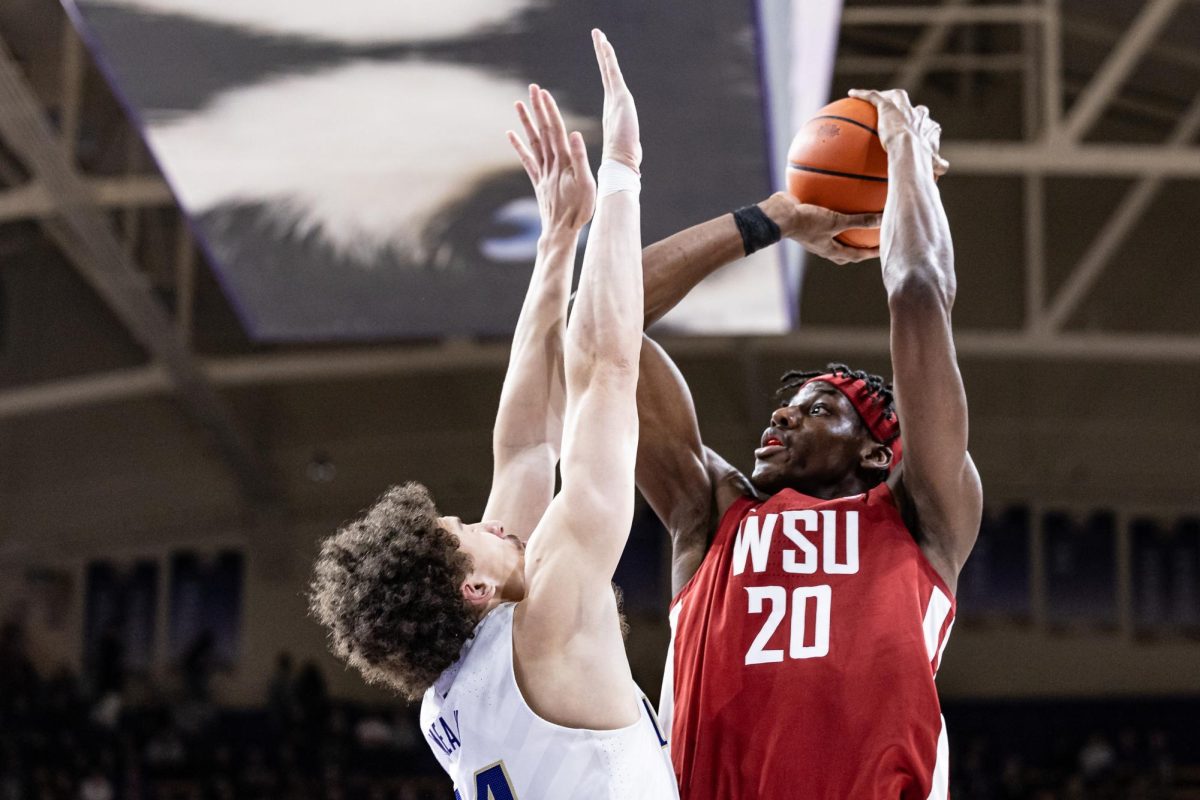 WSU center Rueben Chinyelu shooting the ball during an NCAA men’s basketball match against UW, Feb. 4, 2024, in Seattle.