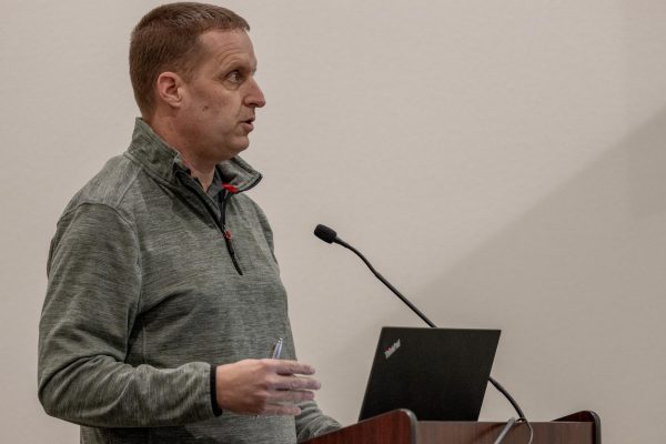 Community developer RJ Lott presents resolutions surrounding Spin bicycles to city council, Feb. 27, in Pullman, Wash. 